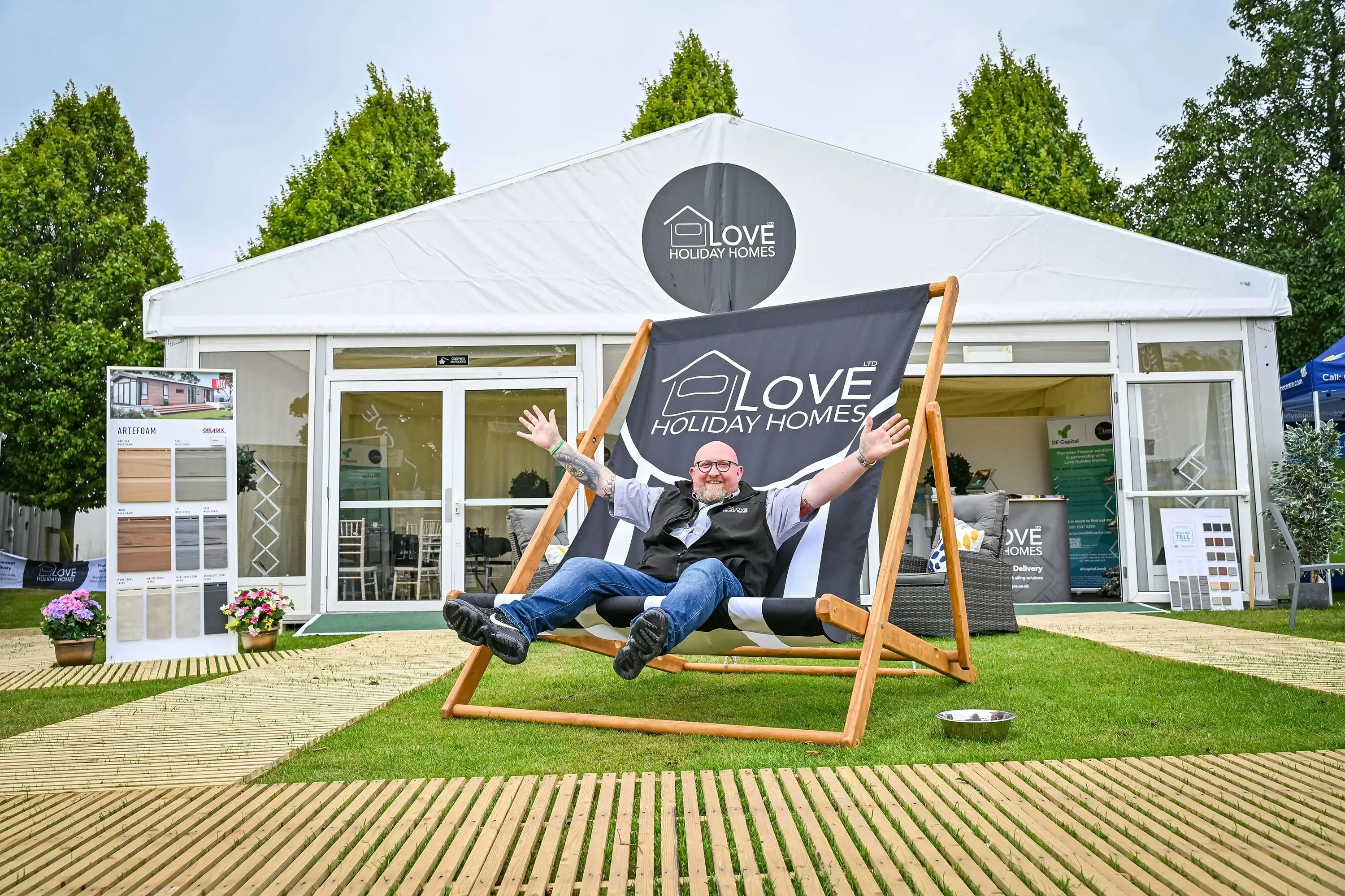 Man happy on large deck chair